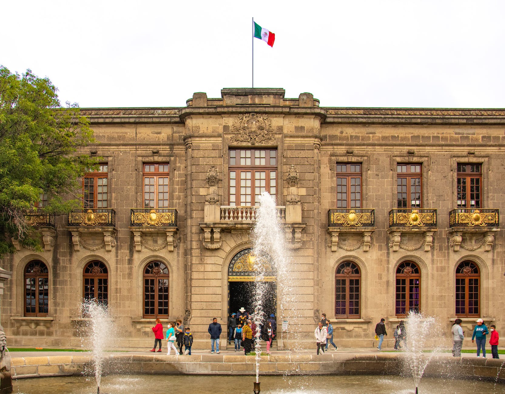 the building has a fountain in front of it