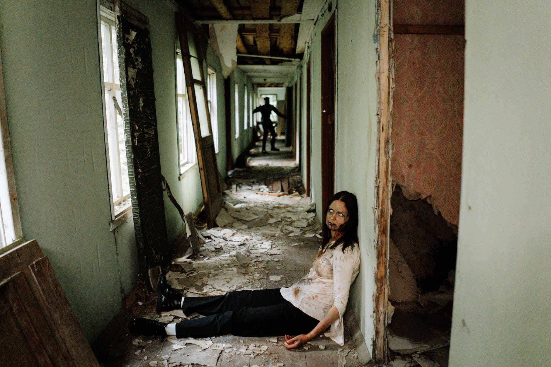 female zombie sitting on the floor